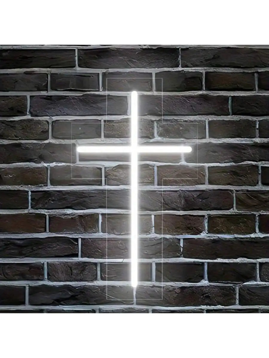 a white cross on a brick wall